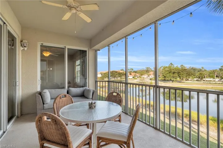 Screened in lanai with ceiling fan and a water view