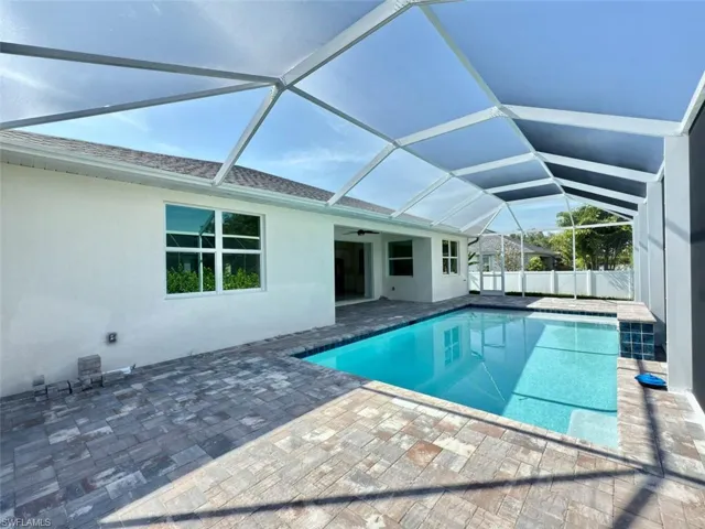 View of pool with extended paver pool deck