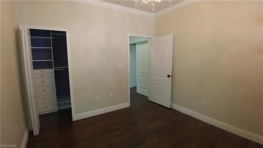 Built-In closet, crown molding, laminate flooring & 6" baseboards