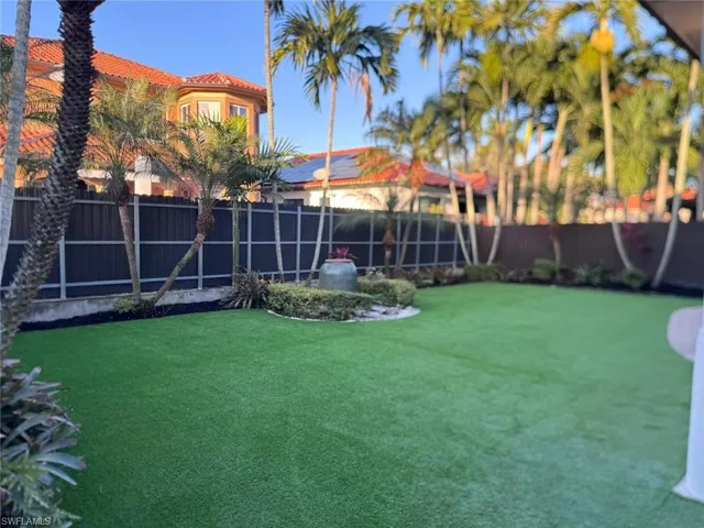 Fenced backyard artificial astro-turf