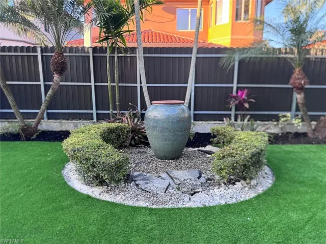 fenced backyard artificial astro-turf