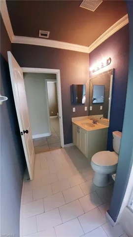 Full Bathroom downstairs leads out to the Back Porch & fenced yard
