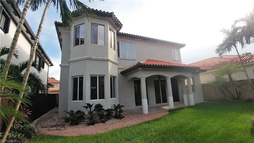 Rear View of home w/brick paved walkway & Open Porch