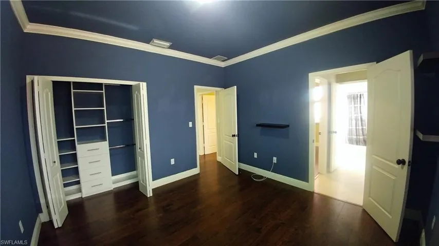 Bedroom, custom closet wood-style floors & ornamental molding