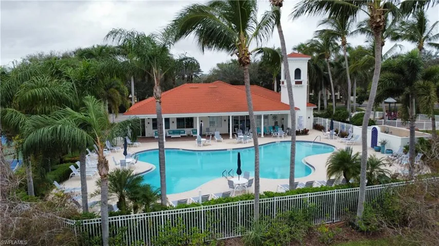 Community pool with a patio