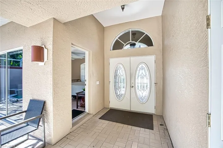 Foyer entrance featuring french doors