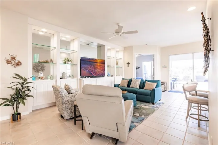 Great room with built in cabinets and display shelves.
