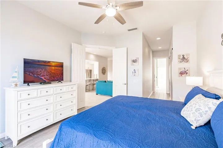 Master has hallway of closets leading to the bathroom.