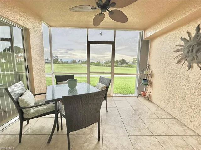 The lanai opens to the green of the golf course.