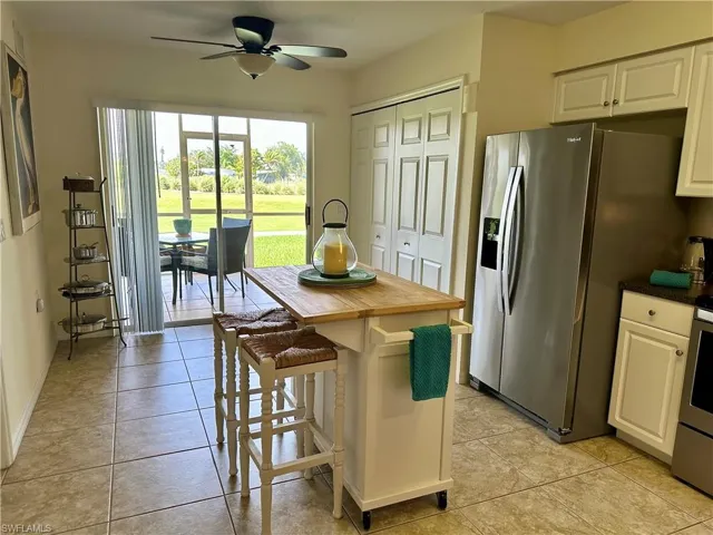 The generous size kitchen has a moveable island/breakfast bar, and bifold that cover the laundry area and the pantry.