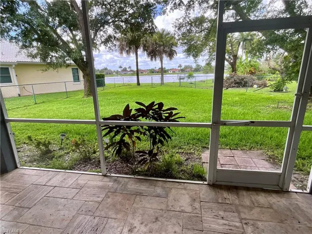 Unfurnished sunroom with a water view