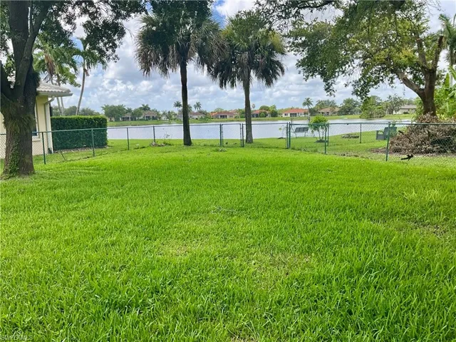 View of yard with a water view