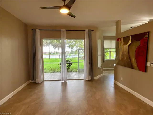 Spare room with a ceiling fan and a water view