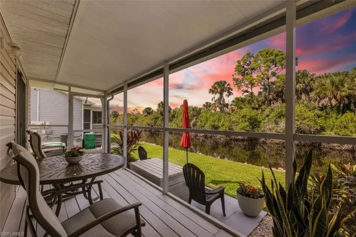 Sunroom featuring a deck