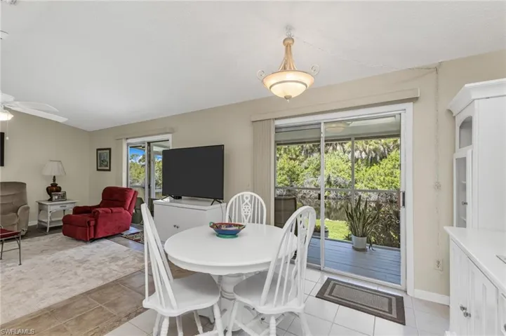 Dining space featuring a ceiling fan and light tile patterned floors