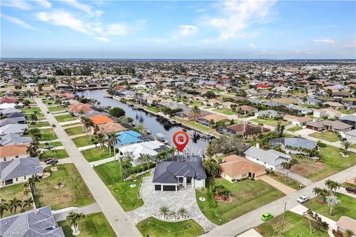 Drone / aerial view with a water view and a residential view