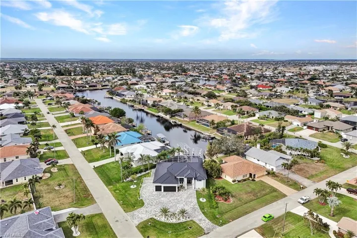 Aerial view with a water view and a residential view