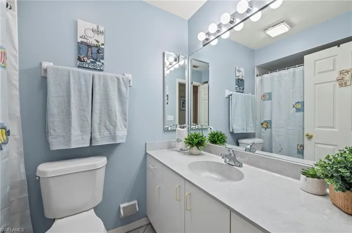 Bathroom with vanity and toilet