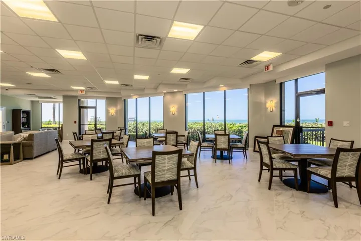 Dining area featuring a drop ceiling and light tile patterned floors