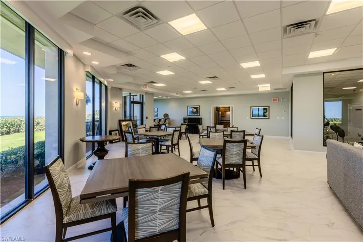 Tiled dining area with a paneled ceiling