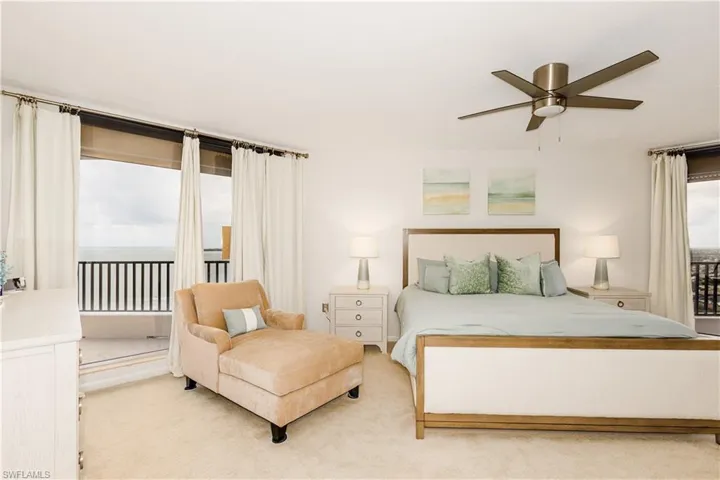 Carpeted bedroom with ceiling fan