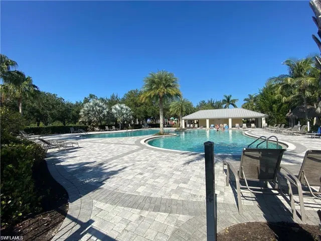Community pool with a patio area