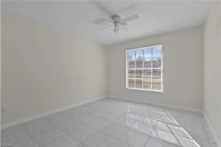 Empty room featuring ceiling fan
