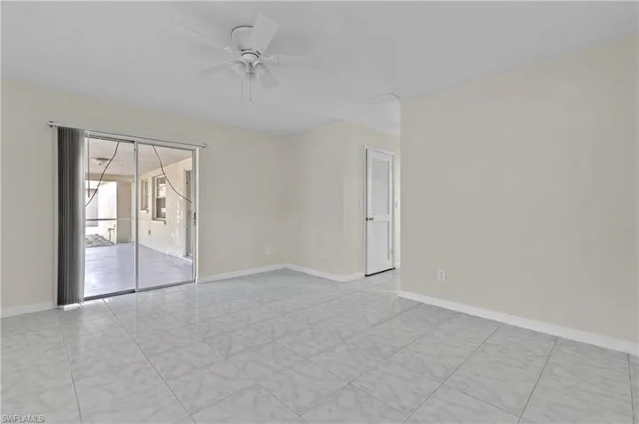 Empty room featuring ceiling fan