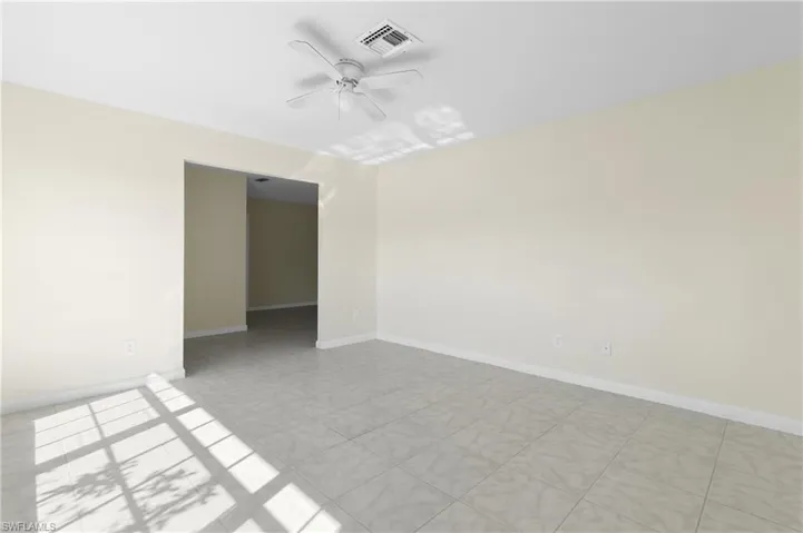 Unfurnished room featuring ceiling fan