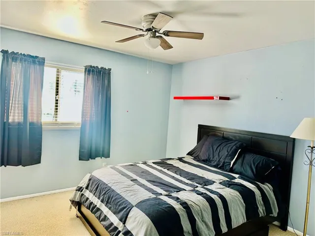Bedroom with carpet flooring and ceiling fan
