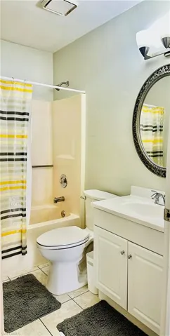 Full bath with shower / bathtub combination with vanity, and tile floors