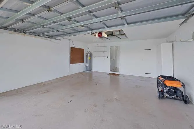 Garage with water heater and a garage door opener