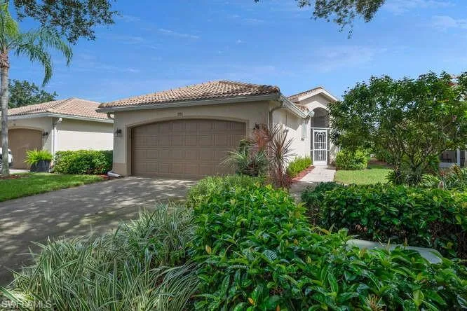 Mediterranean / spanish-style house featuring a garage