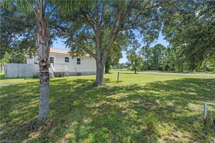 View of yard with a deck