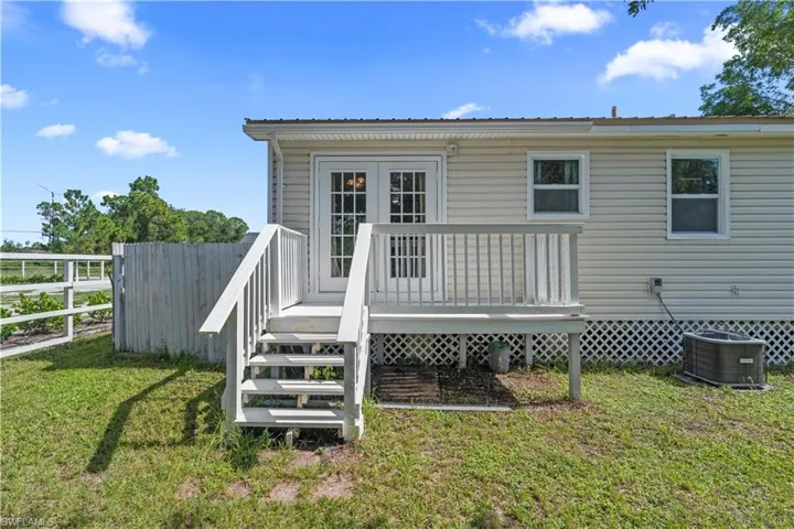 Rear view of property with a deck