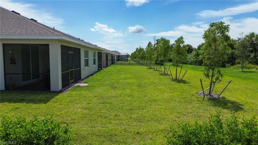 View of yard with a sunroom
