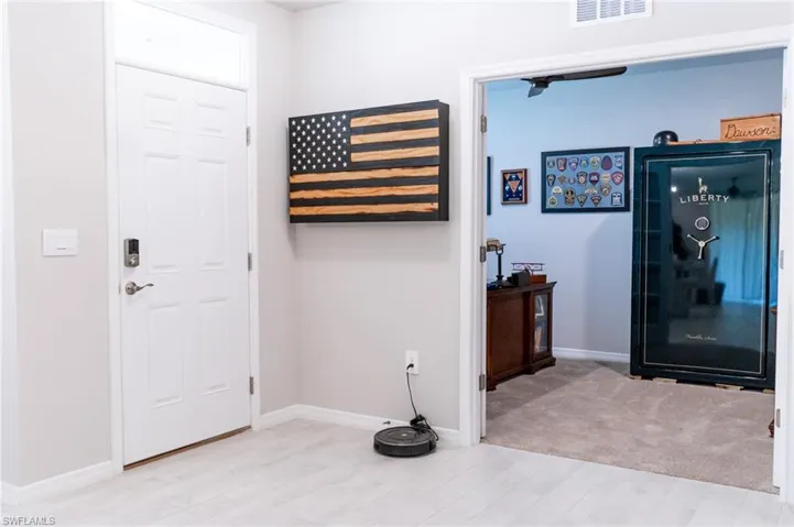 Entryway with light hardwood / wood-style flooring