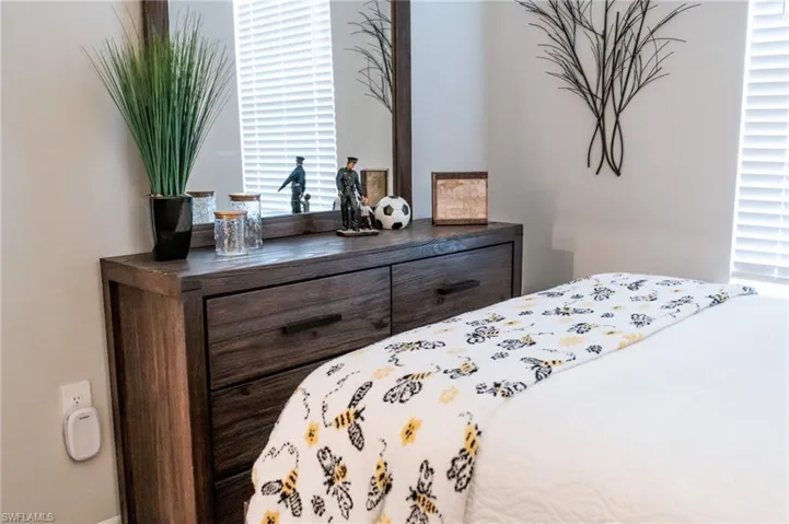 Bedroom with multiple windows