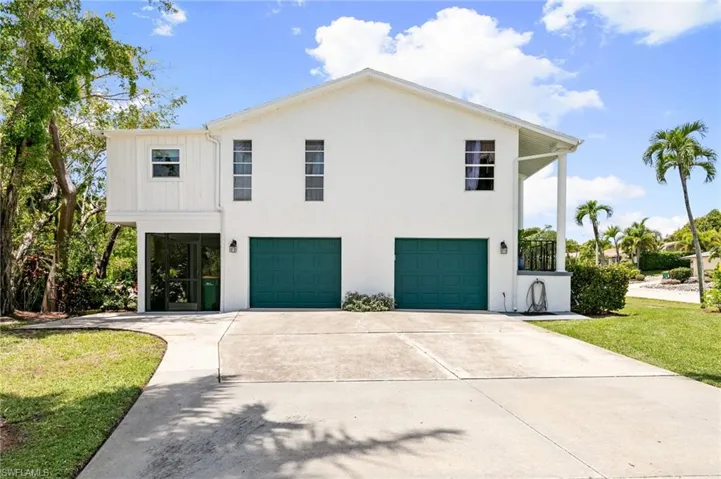 Oversized 2 1/2 car garage with workbench, extra storage