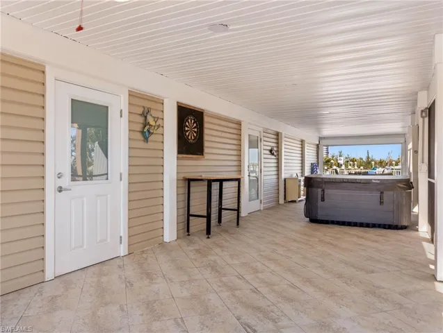 Breezeway provides additional protected outdoor area - relax in the hot tub!