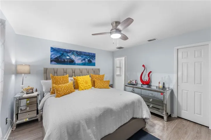 Bedroom featuring ceiling fan and wood-type flooring