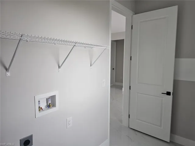 Laundry area featuring hookup for a washing machine and electric dryer hookup