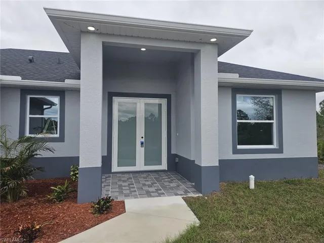 Property entrance with french doors