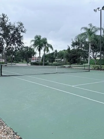 View of tennis court featuring community basketball court