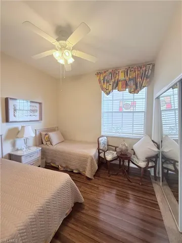 Bedroom featuring wood finished floors and a ceiling fan