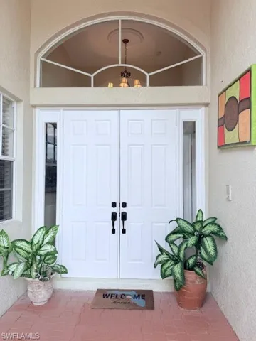 Property entrance with stucco siding
