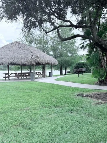 View of home's community with a gazebo and a lawn