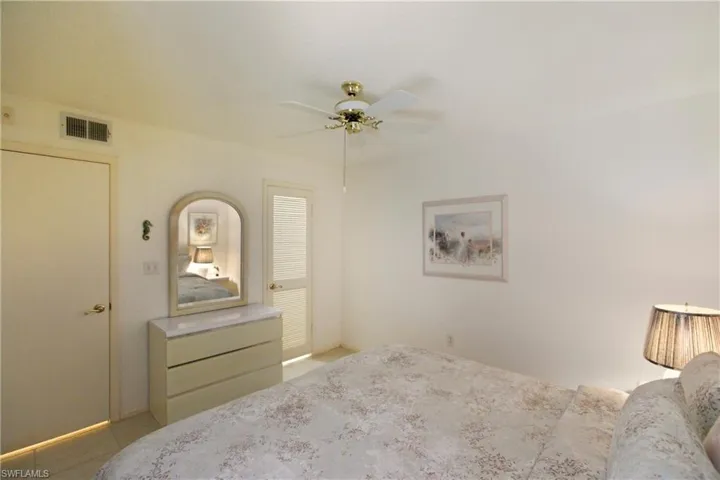 Bedroom featuring a ceiling fan and baseboards
