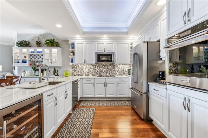 Updated Kitchen With S/S Appliances, New Backsplash, Quartz Counters And Wine Fridge