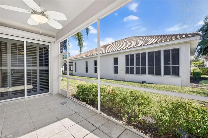 Unfurnished sunroom with a ceiling fan